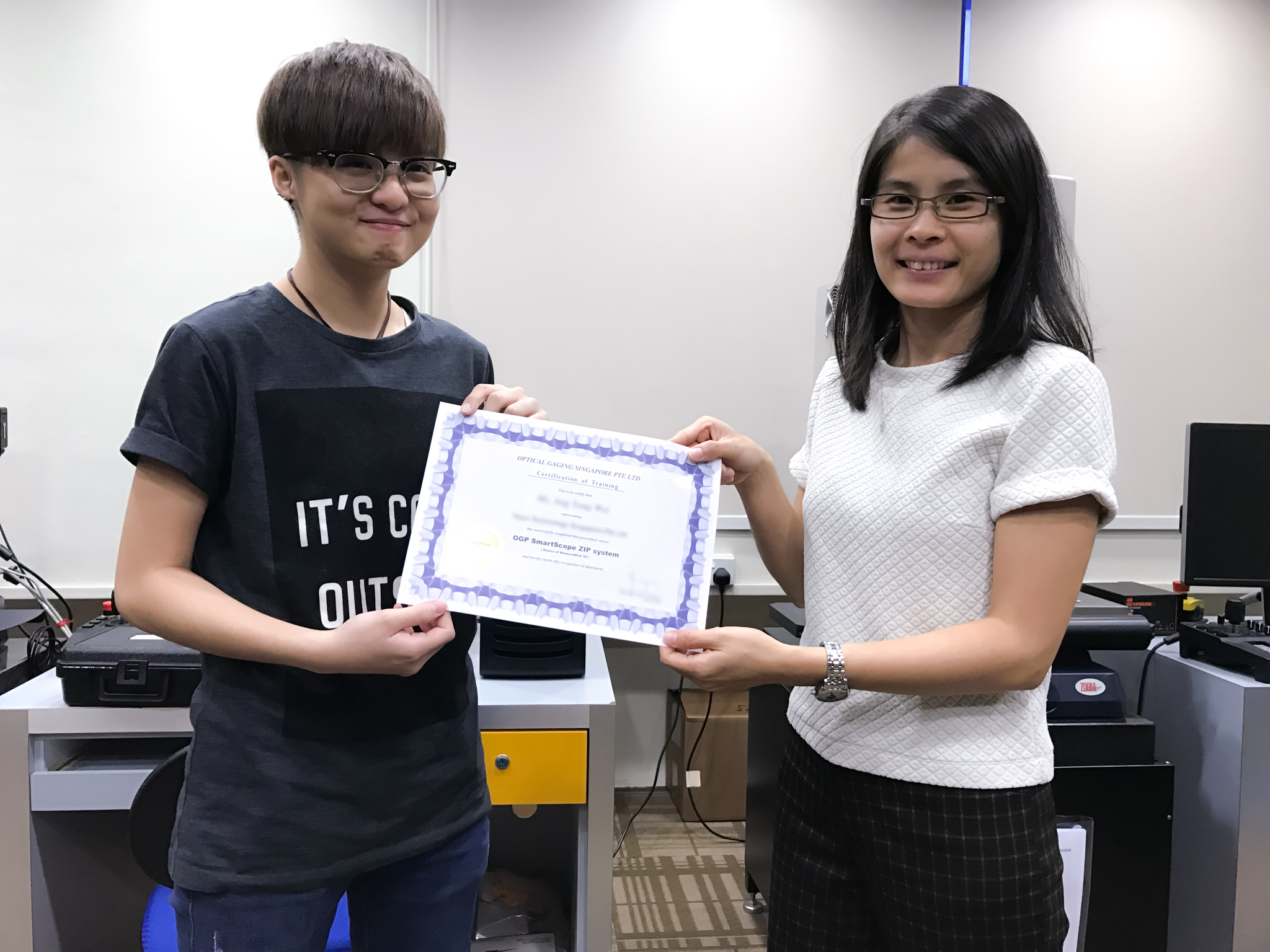 Trainee Holding a SmartScope Ceritfication with the OGS Trainer